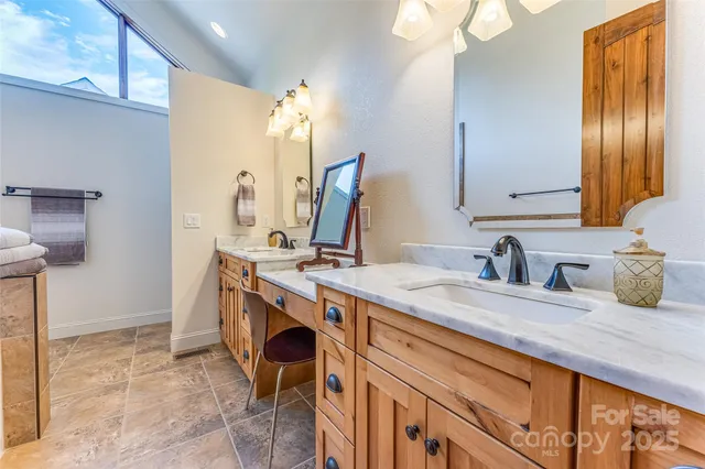 a bathroom with a sink double vanity and a mirror