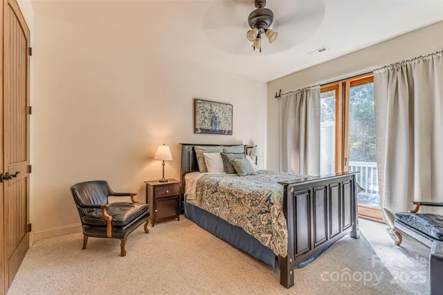 a bed sitting in a bedroom next to a window