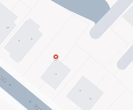 a front view of a house with parking space