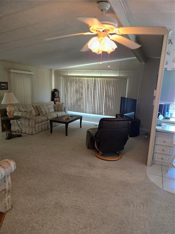 6162 Redwing Avenue Englewood, FL 34224 - Photo 18 of 23 a living room with furniture and a chandelier