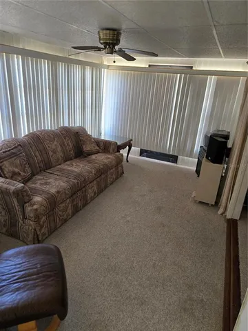 a living room with a couch and a flat screen tv