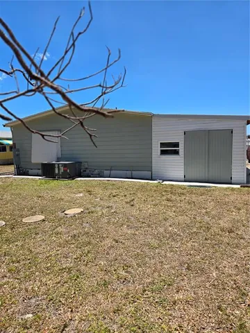 a view of a backyard of the house