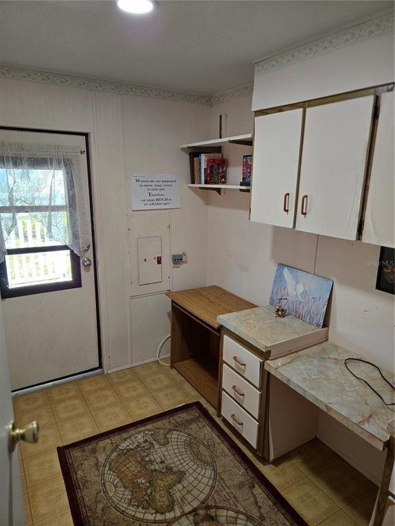 6162 Redwing Avenue Englewood, FL 34224 - Photo 5 of 23 a room with a bed and wooden floor