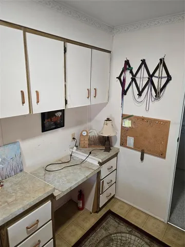 a living room with granite countertop furniture and a couch