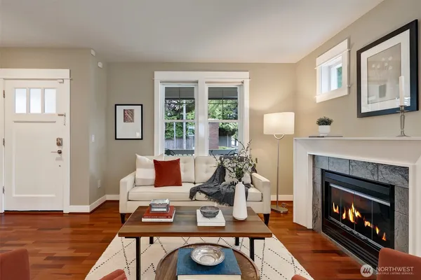 a living room with furniture and a fireplace