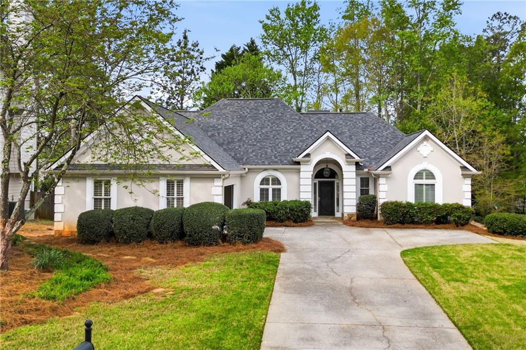 3875 Montvale Crossing Cumming, GA 30041 - Photo 2 of 53 a view of house with yard and green space