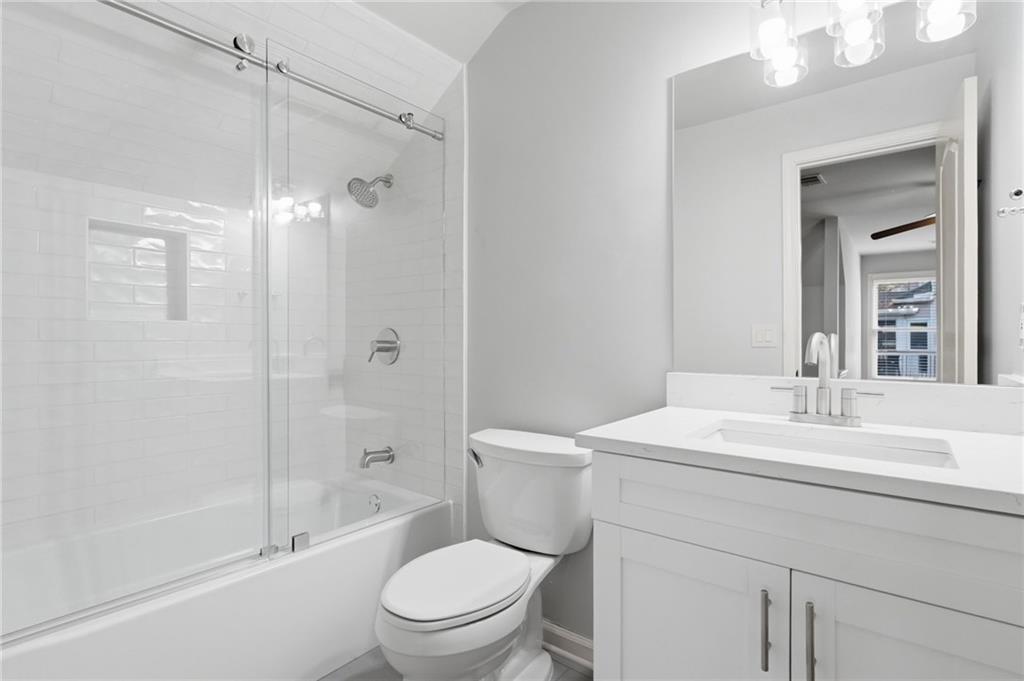 3875 Montvale Crossing Cumming, GA 30041 - Photo 23 of 53 a bathroom with a sink a toilet and shower