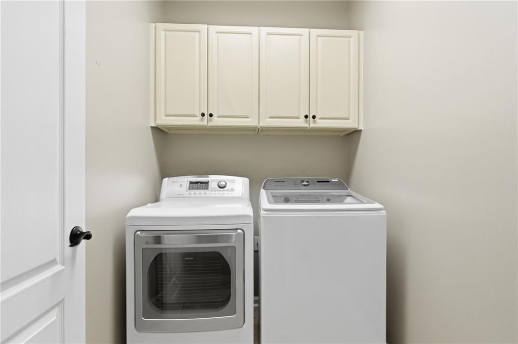 3875 Montvale Crossing Cumming, GA 30041 - Photo 24 of 53 a utility room with dryer and washer