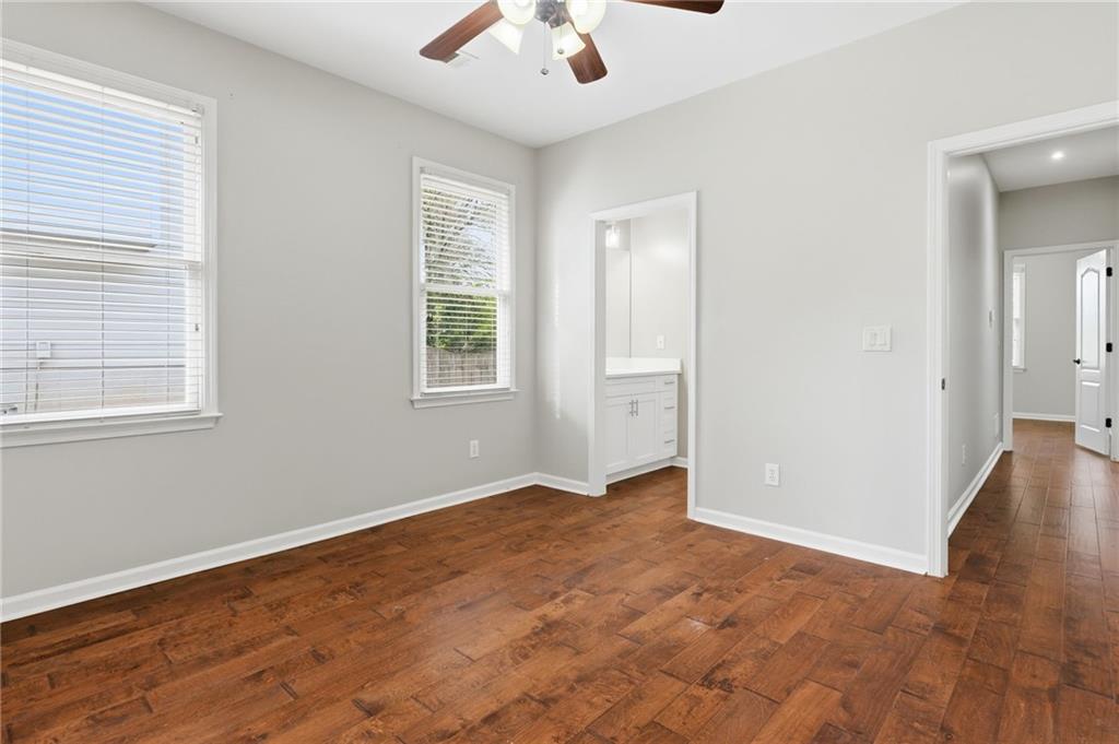 3875 Montvale Crossing Cumming, GA 30041 - Photo 25 of 53 wooden floor in an empty room with a window