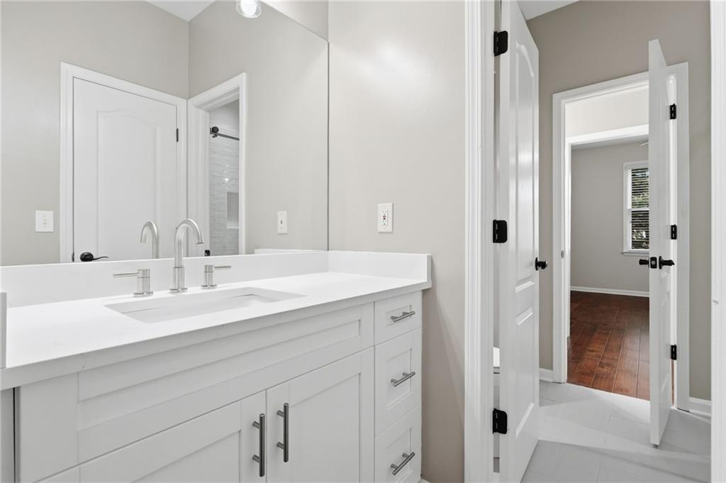 3875 Montvale Crossing Cumming, GA 30041 - Photo 26 of 53 a bathroom with a double vanity sink mirror and shower