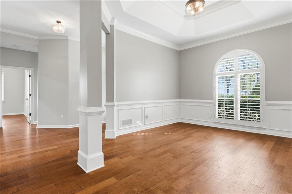 3875 Montvale Crossing Cumming, GA 30041 - Photo 29 of 53 an empty room with wooden floor and windows