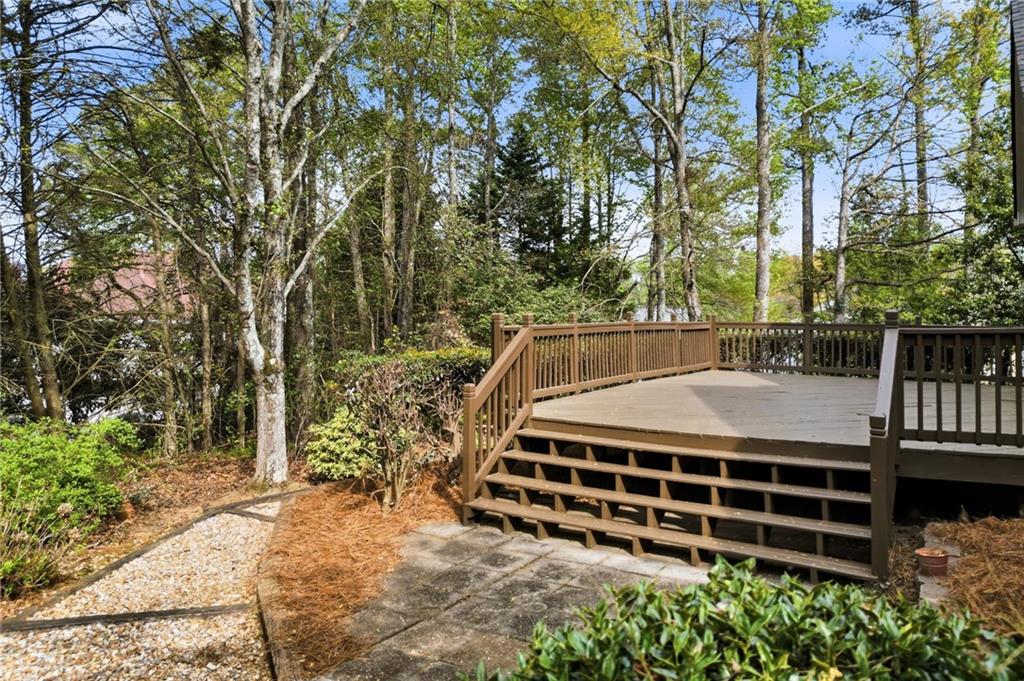 3875 Montvale Crossing Cumming, GA 30041 - Photo 44 of 53 a view of backyard with deck and a garden