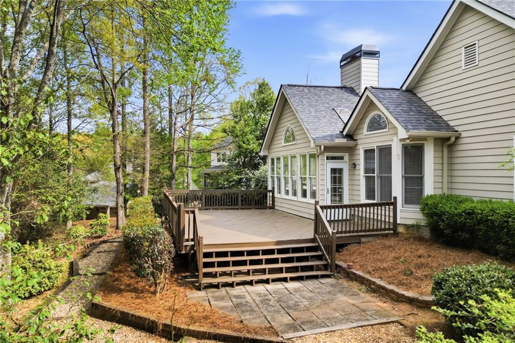 3875 Montvale Crossing Cumming, GA 30041 - Photo 45 of 53 a front view of a house with a garden