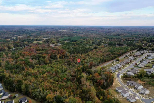 an aerial view of residential house and outdoor space