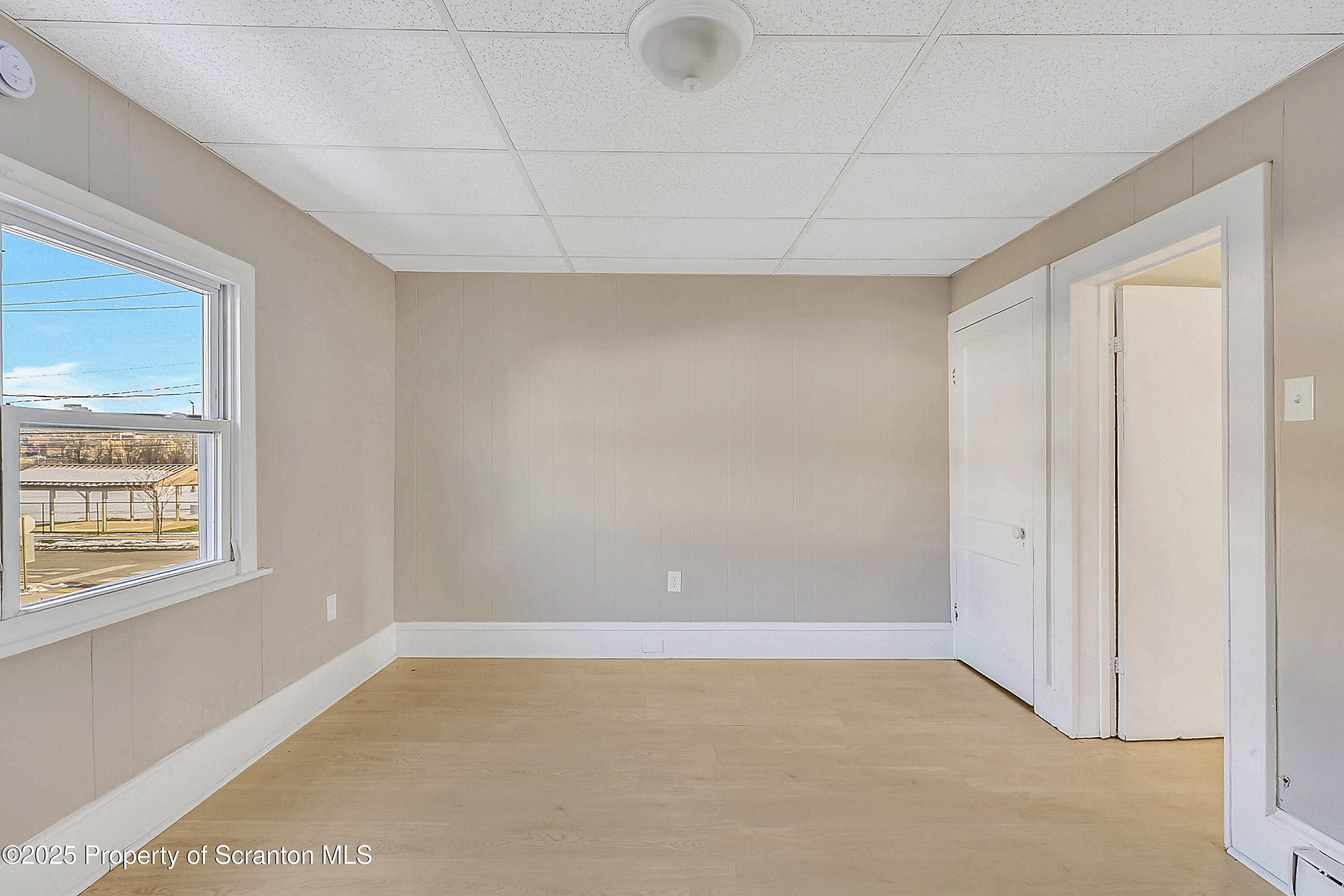 1007 Washburn Street, Unit 2 Scranton, PA 18504 - Photo 6 of 16 a view of an empty room with a window