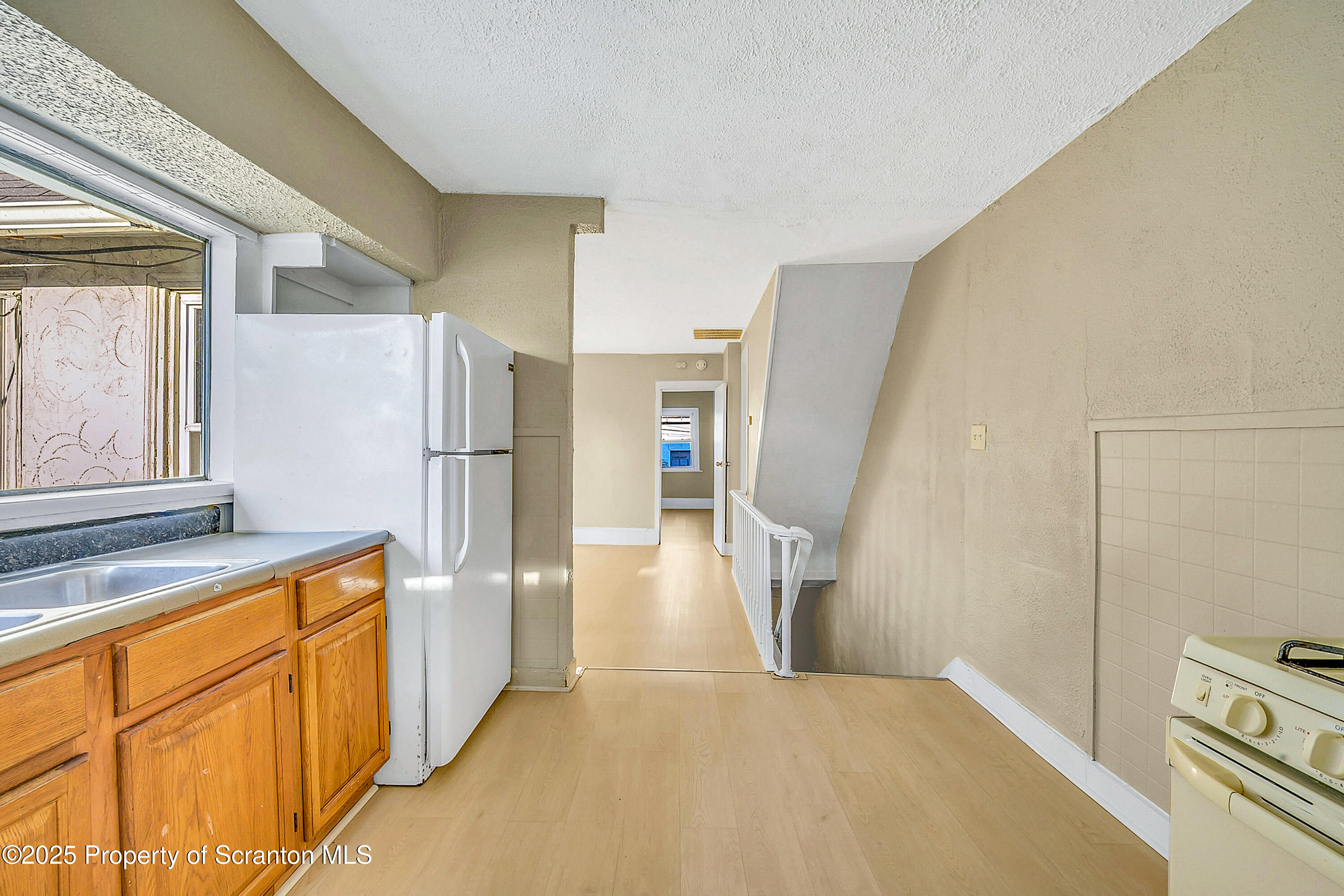 1007 Washburn Street, Unit 2 Scranton, PA 18504 - Photo 10 of 16 a kitchen with stainless steel appliances a refrigerator and a stove