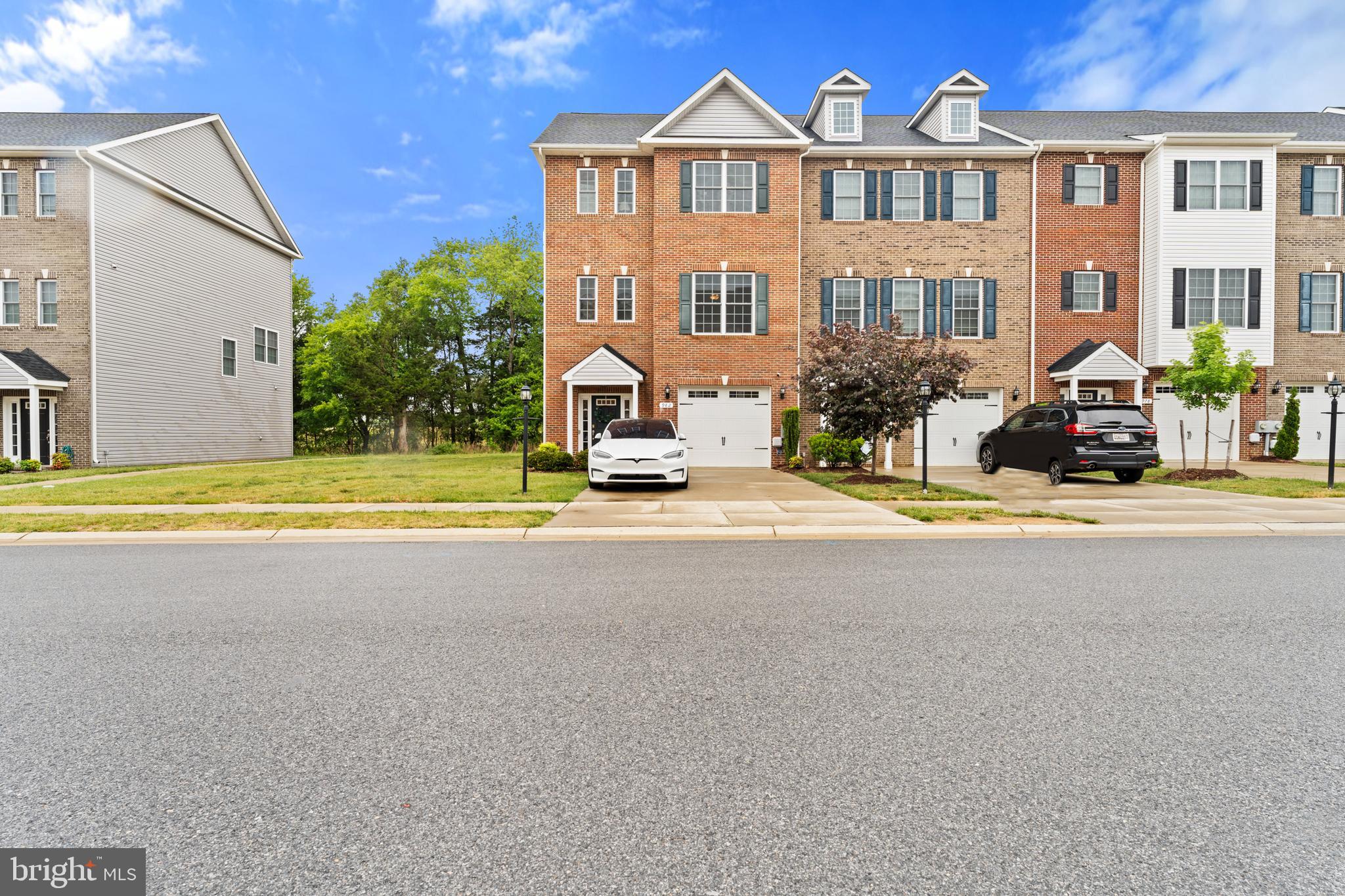 982 Rye Drive La Plata, MD 20646 - Photo 1 of 42 Front exterior of brick townhome