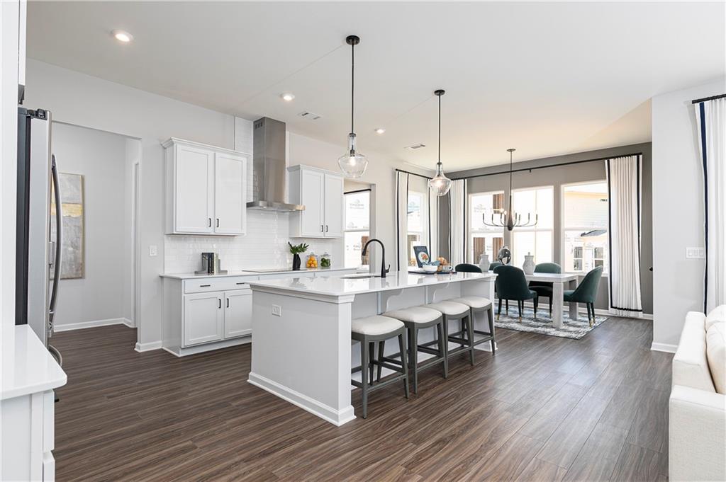 752 Coventry Cv Way Acworth, GA 30102 - Photo 12 of 34 a living room with furniture and a wooden floor