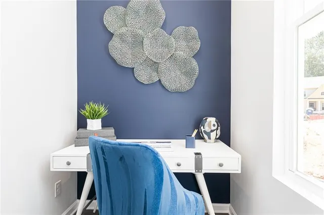 a view of entryway with chandelier fan