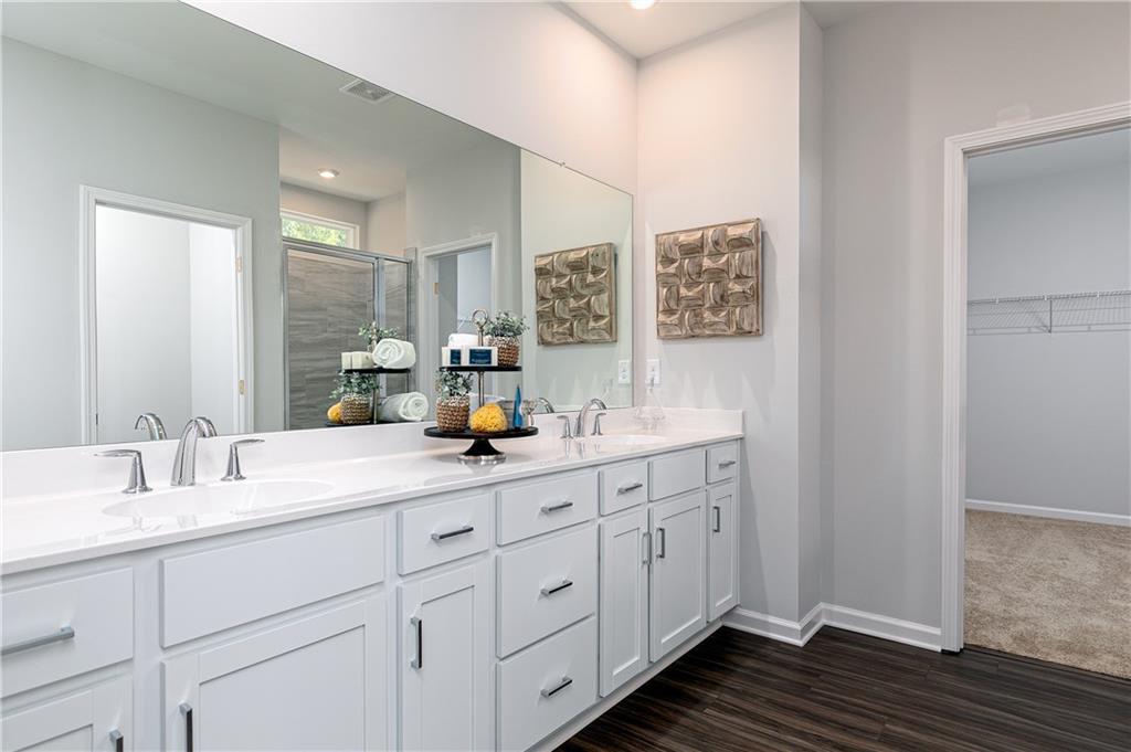 752 Coventry Cv Way Acworth, GA 30102 - Photo 29 of 34 a bathroom with double sink and a mirror