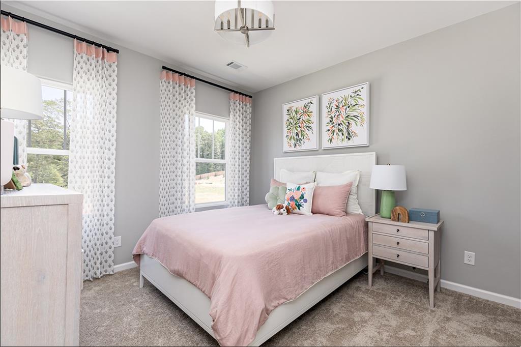 752 Coventry Cv Way Acworth, GA 30102 - Photo 32 of 34 a bedroom with a bed and a window