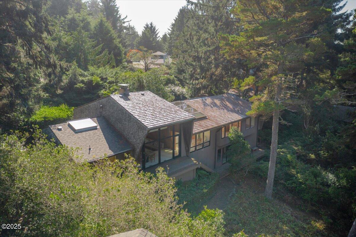 110 Ridge Crest Road Gleneden Beach, OR 97388 - Photo 2 of 72 an aerial view of a house with yard and outdoor seating