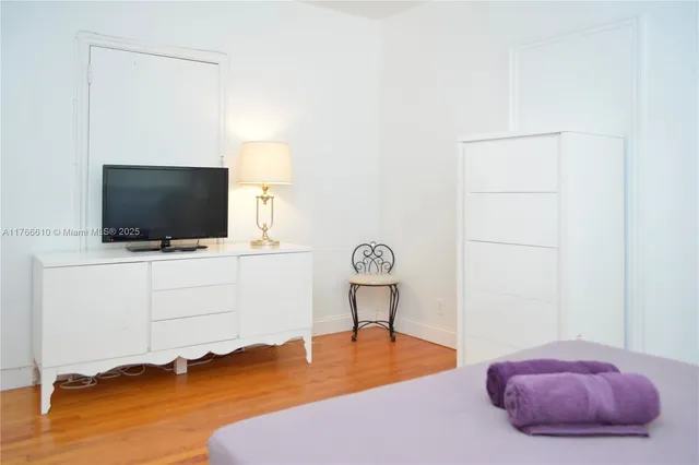 a view of a livingroom with furniture and wooden floor