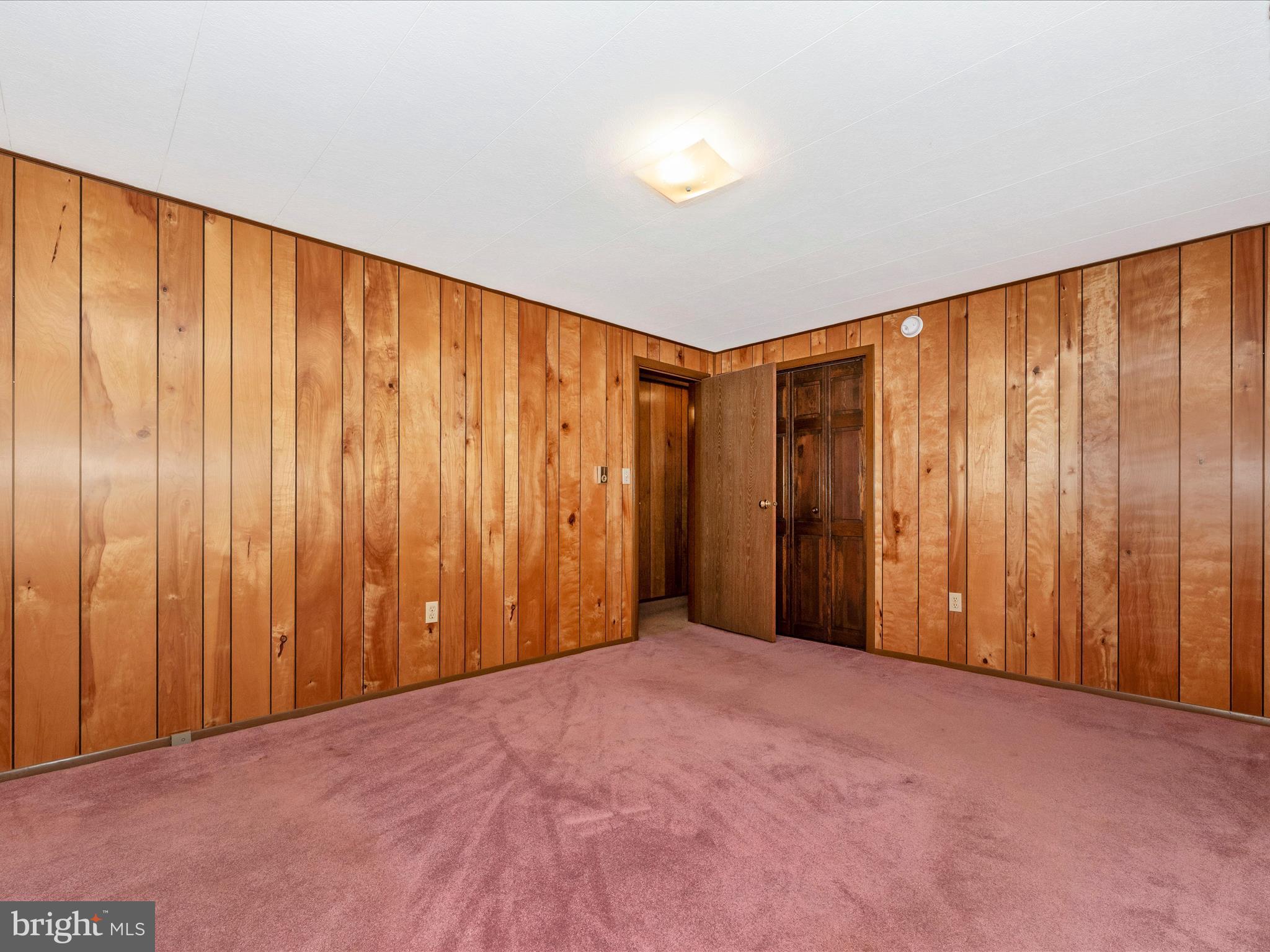11732 Warner Road Keymar, MD 21757 - Photo 21 of 59 a view of an empty room with wooden walls