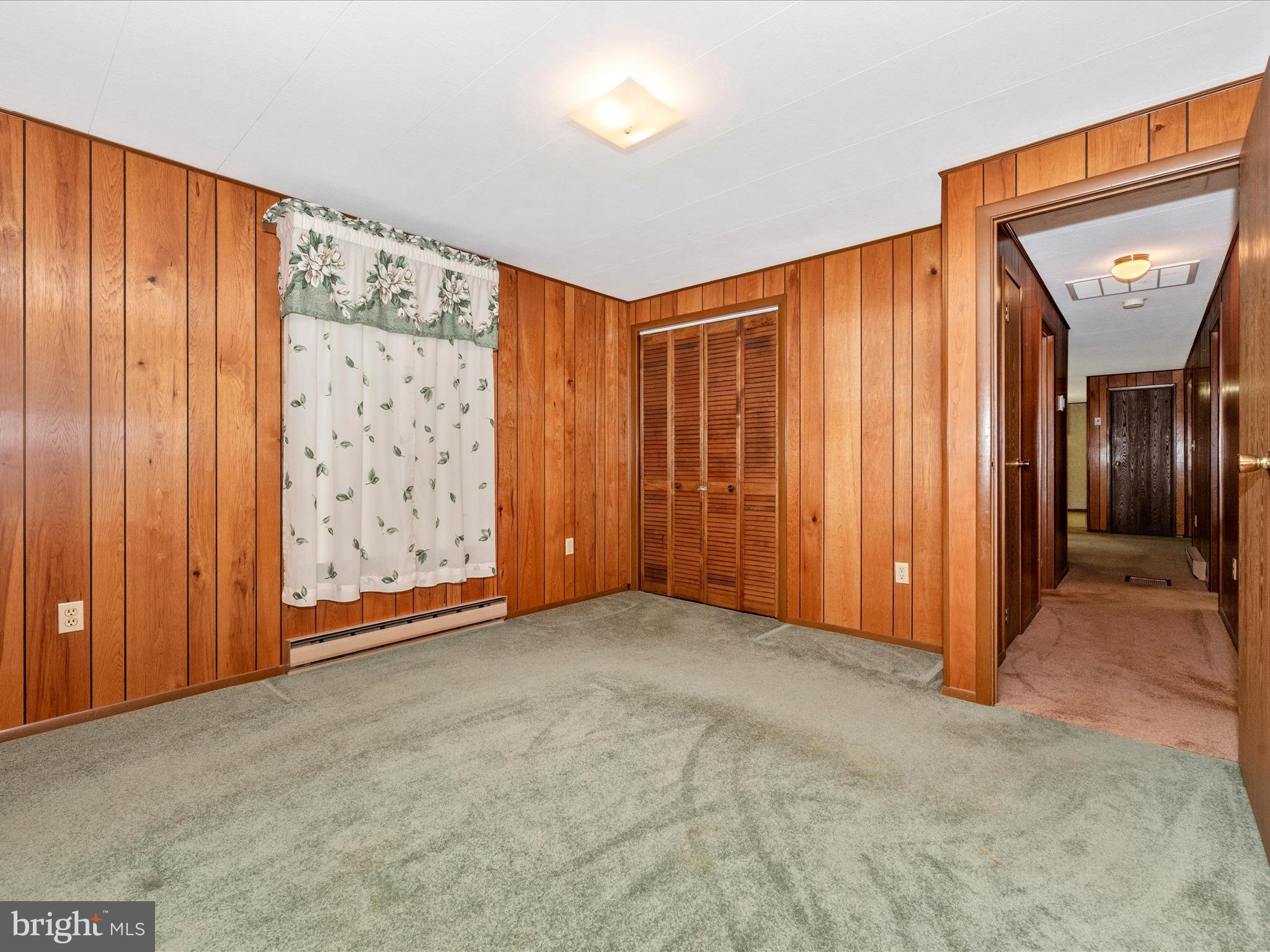11732 Warner Road Keymar, MD 21757 - Photo 25 of 59 an empty room with closet and bathroom view
