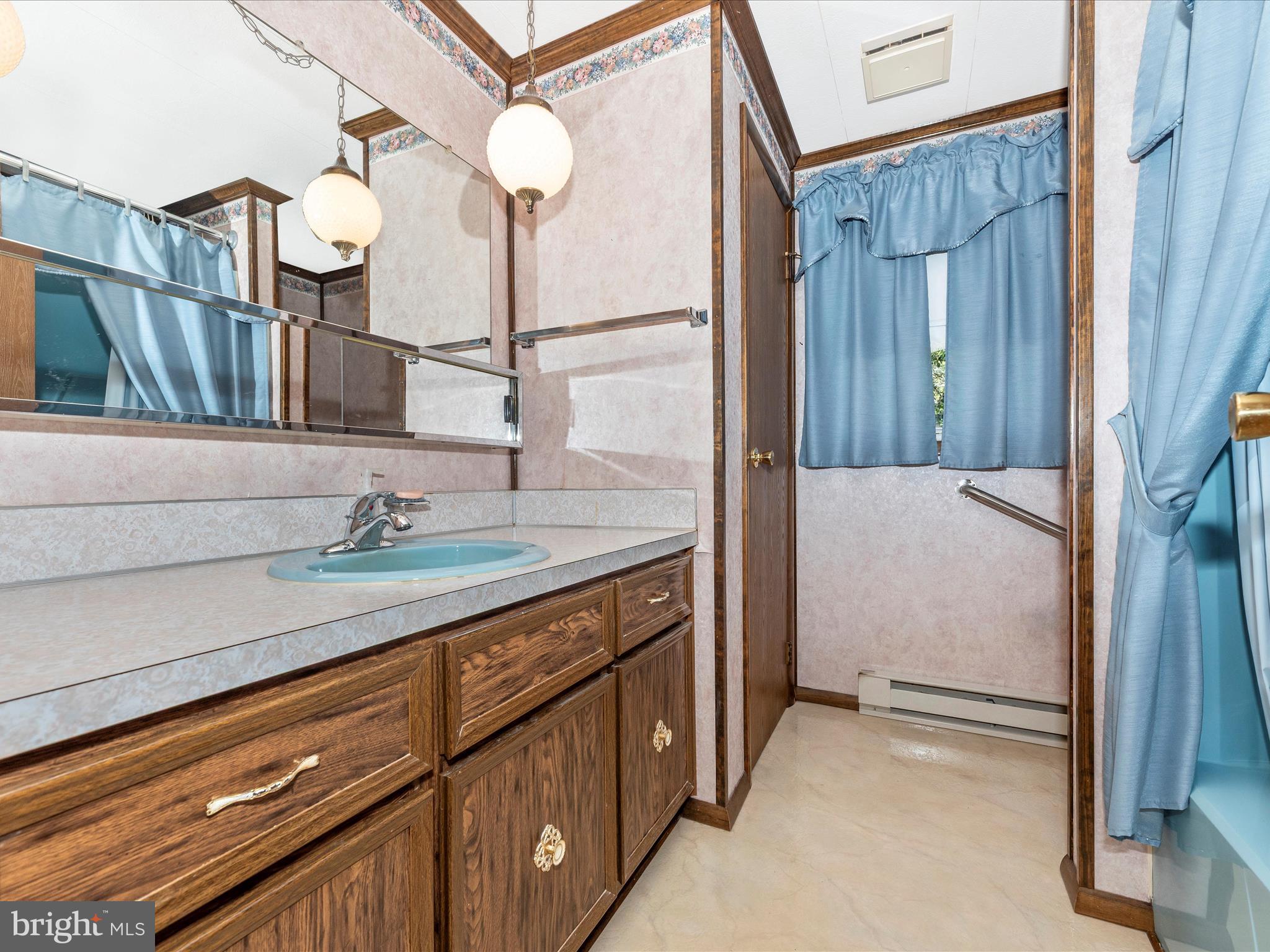 11732 Warner Road Keymar, MD 21757 - Photo 28 of 59 a bathroom with a sink and a mirror