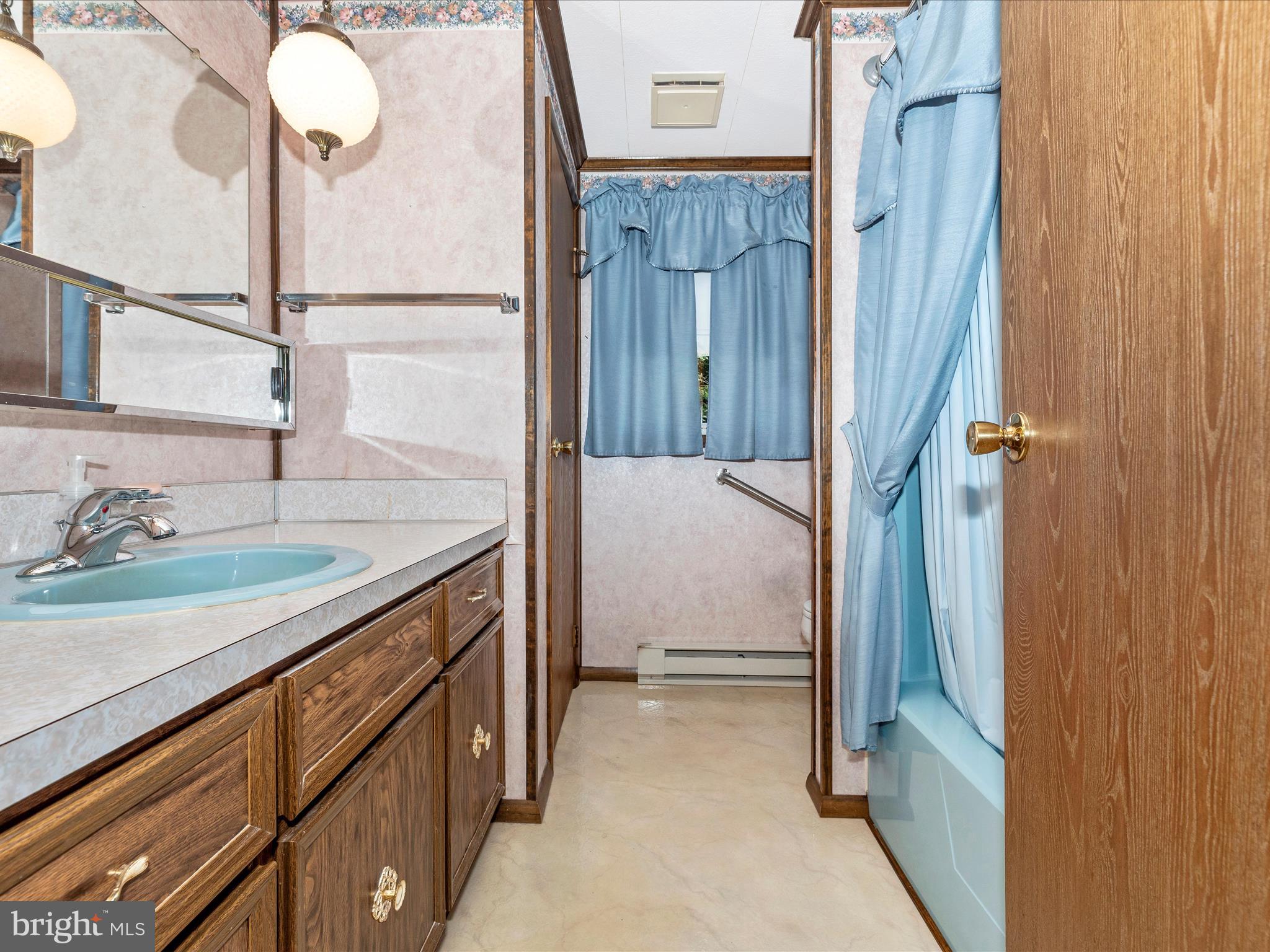 11732 Warner Road Keymar, MD 21757 - Photo 29 of 59 a bathroom with a granite countertop sink and a mirror