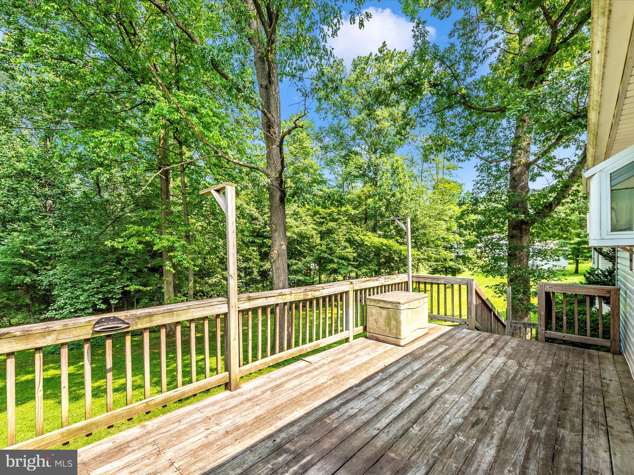 11732 Warner Road Keymar, MD 21757 - Photo 42 of 59 a view of a wooden deck with a yard