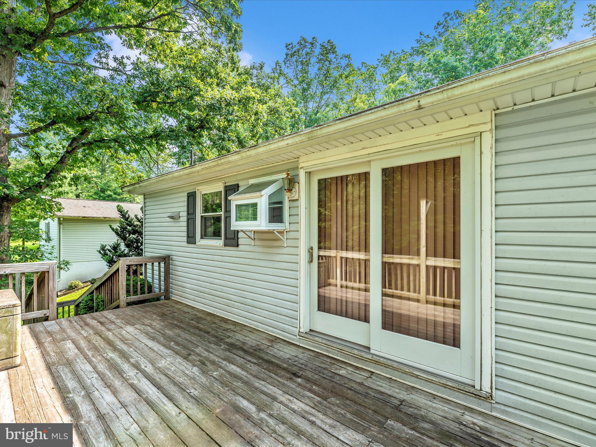 11732 Warner Road Keymar, MD 21757 - Photo 43 of 59 a view of a house with a wooden deck