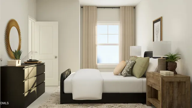 a bedroom with a bed a mirror and a window