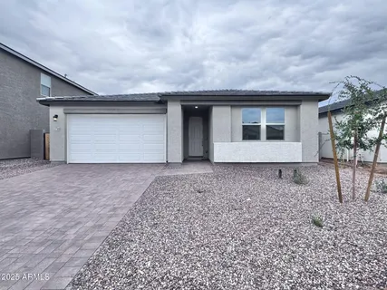 a view of a house with a yard and garage