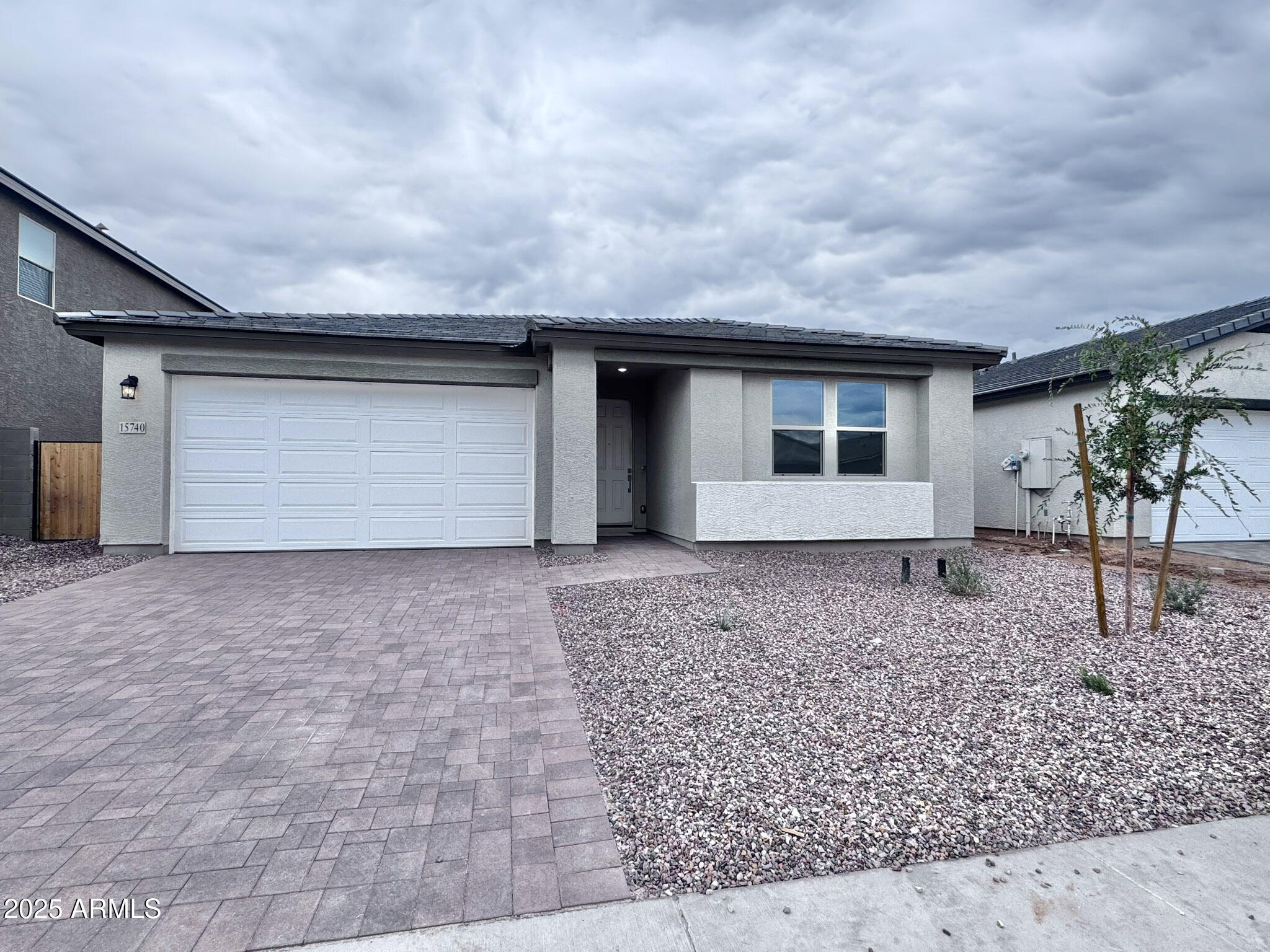 15740 West Camden Avenue Waddell, AZ 85355 - Photo 3 of 38 a front view of a house with garden