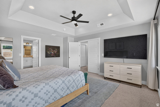 1263 East 1200th South Springville, UT 84663 - Photo 16 of 60 Recessed lighting and a ceiling fan with light fixture illuminate a bedroom featuring a tray ceiling, light gray walls, and carpet flooring