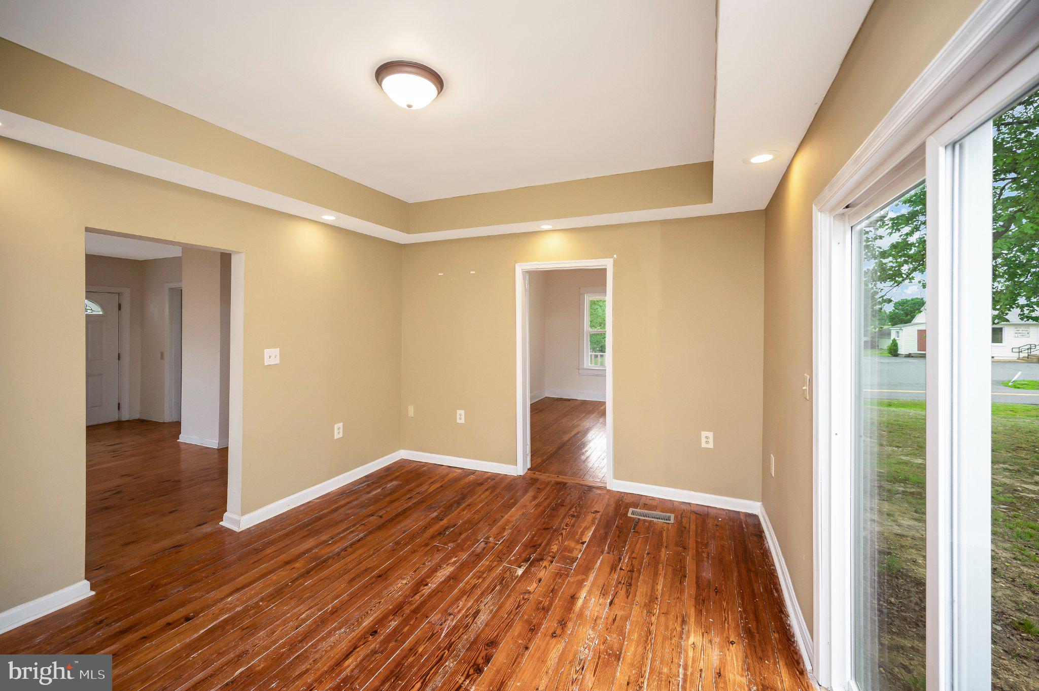 23202 Village Road Unionville, VA 22567 - Photo 15 of 58 a view of wooden floor in an empty room with a window