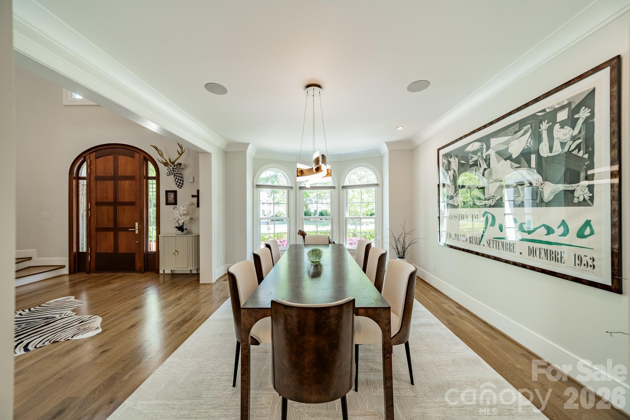 5400 Colony Road Charlotte, NC 28226 - Photo 12 of 48 a view of a dining room with furniture window and wooden floor