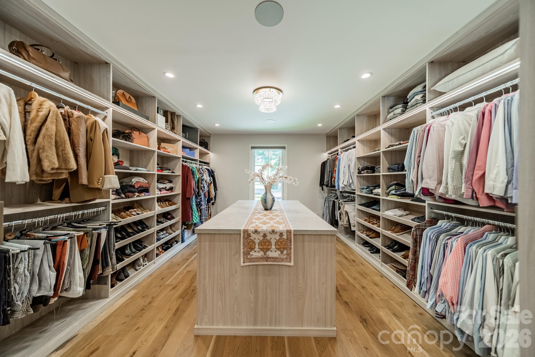 5400 Colony Road Charlotte, NC 28226 - Photo 17 of 48 a view of walk in closet with clothes and shoes