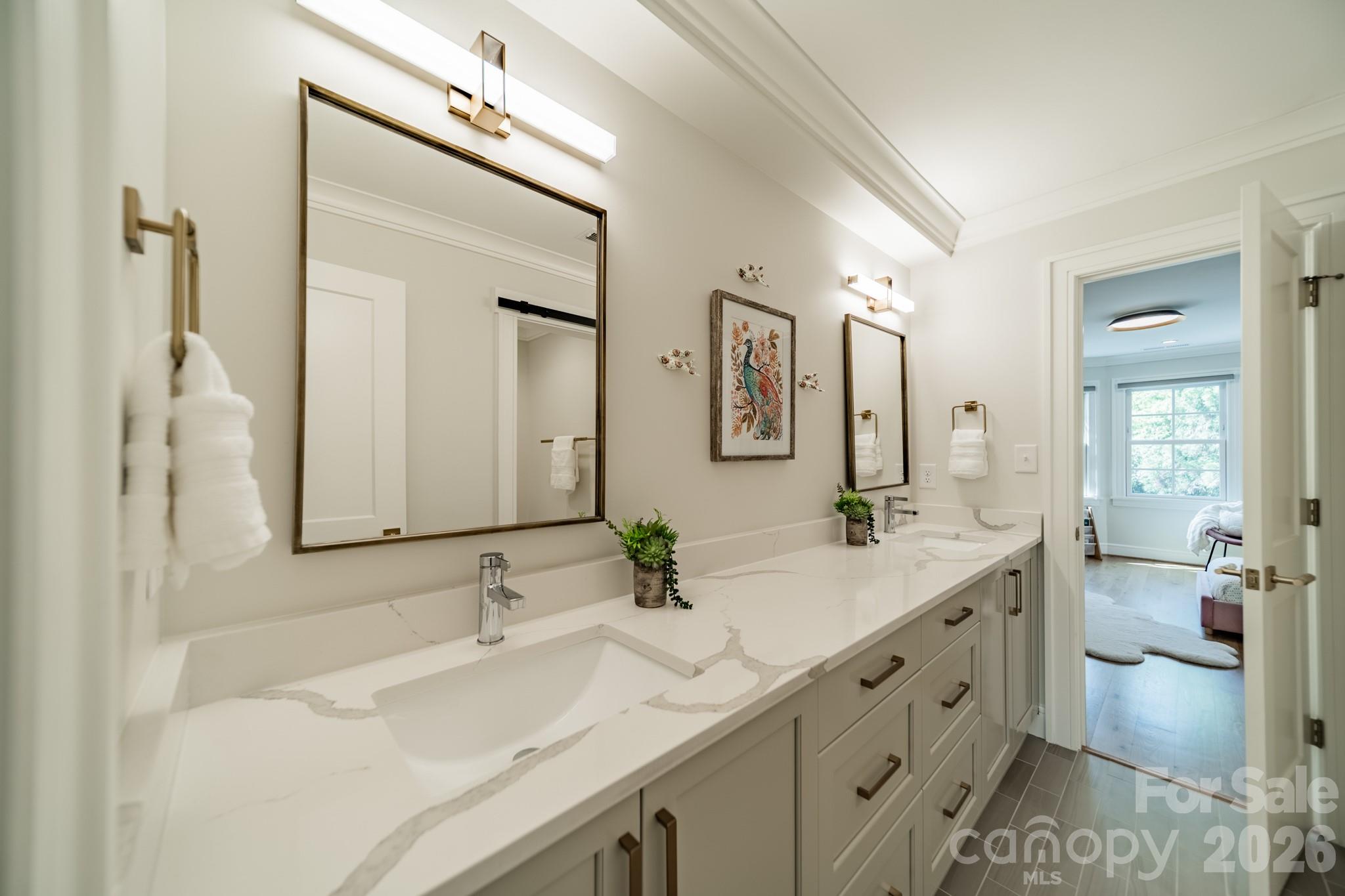 5400 Colony Road Charlotte, NC 28226 - Photo 23 of 48 a bathroom with a double vanity sink toilet mirror and bathtub