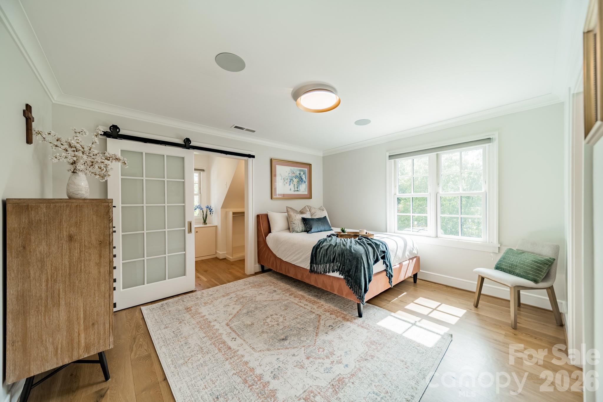 5400 Colony Road Charlotte, NC 28226 - Photo 25 of 48 a spacious bedroom with a bed and a window
