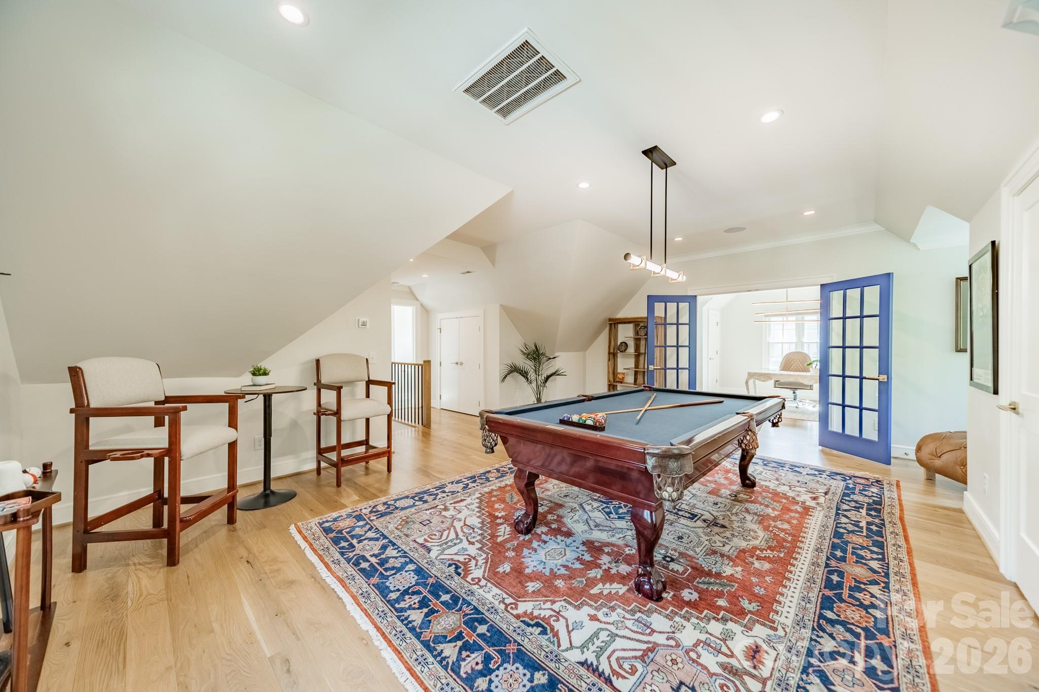 5400 Colony Road Charlotte, NC 28226 - Photo 27 of 48 a living room with furniture a rug and wooden floor