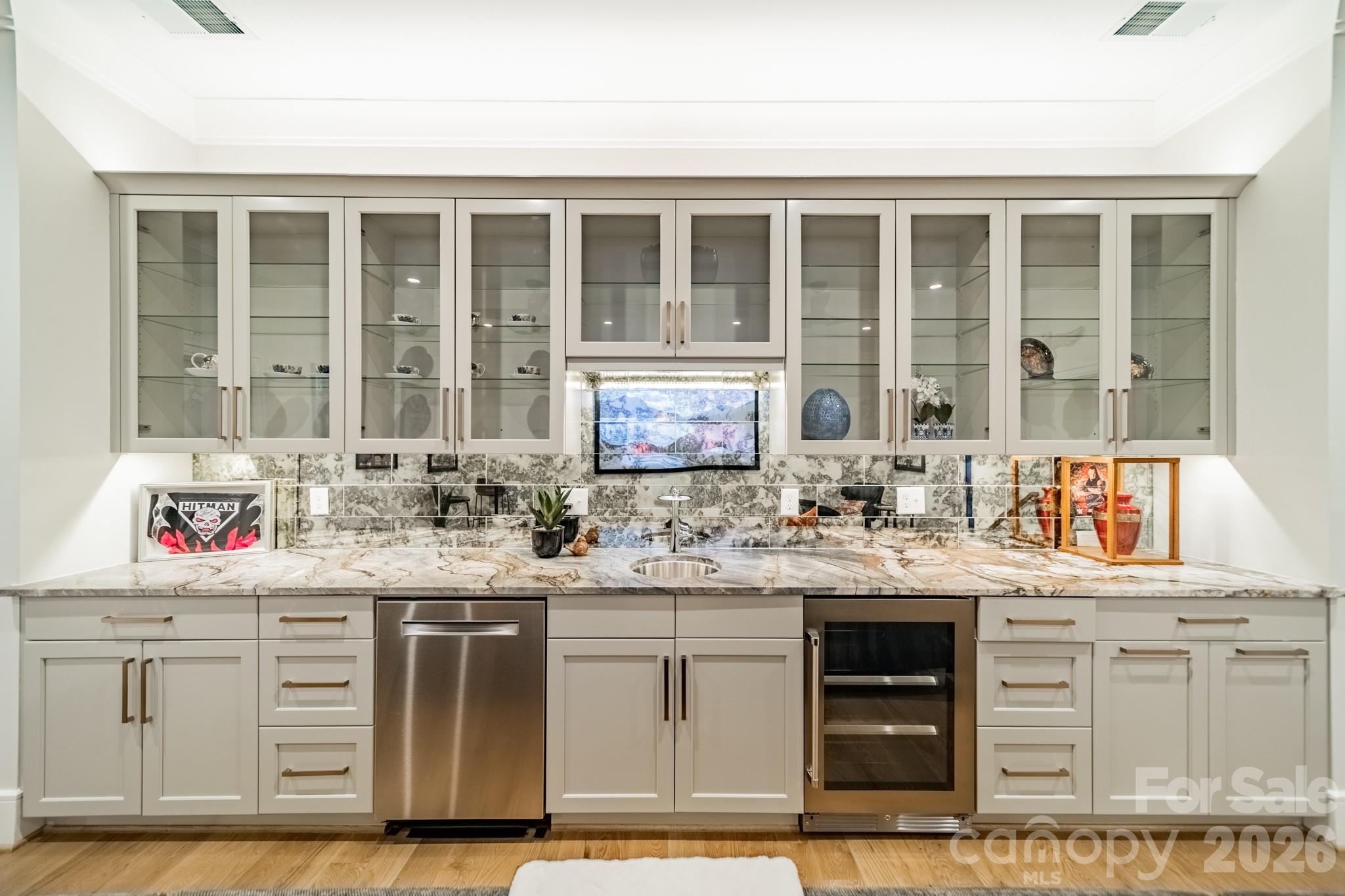 5400 Colony Road Charlotte, NC 28226 - Photo 33 of 48 a kitchen with stainless steel appliances granite countertop a sink and cabinets