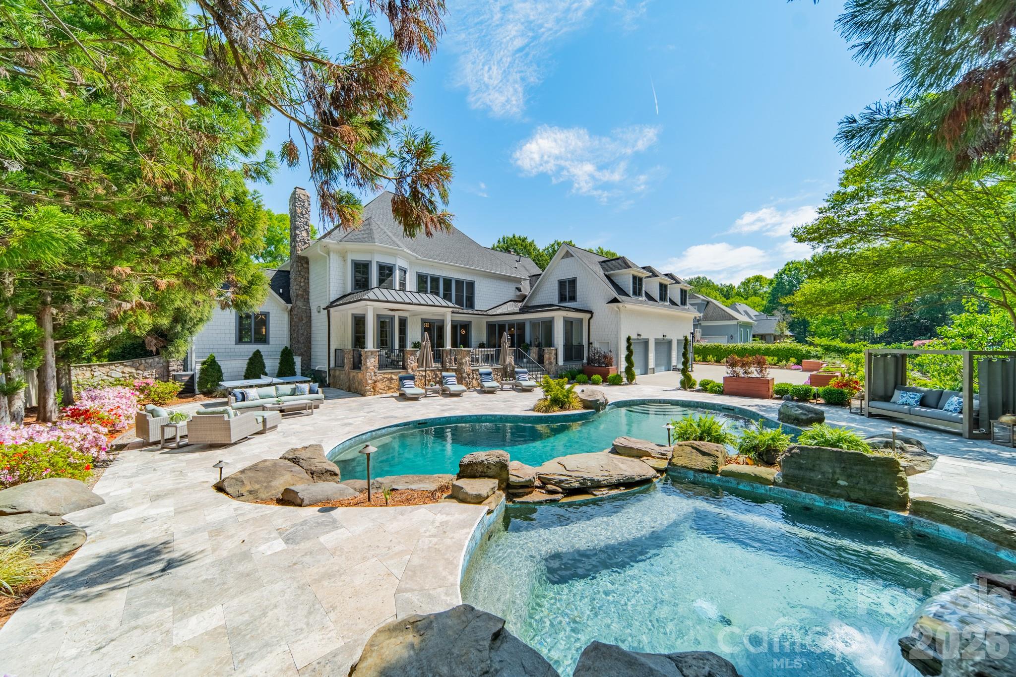 5400 Colony Road Charlotte, NC 28226 - Photo 35 of 48 a front view of a house with swimming pool having outdoor seating