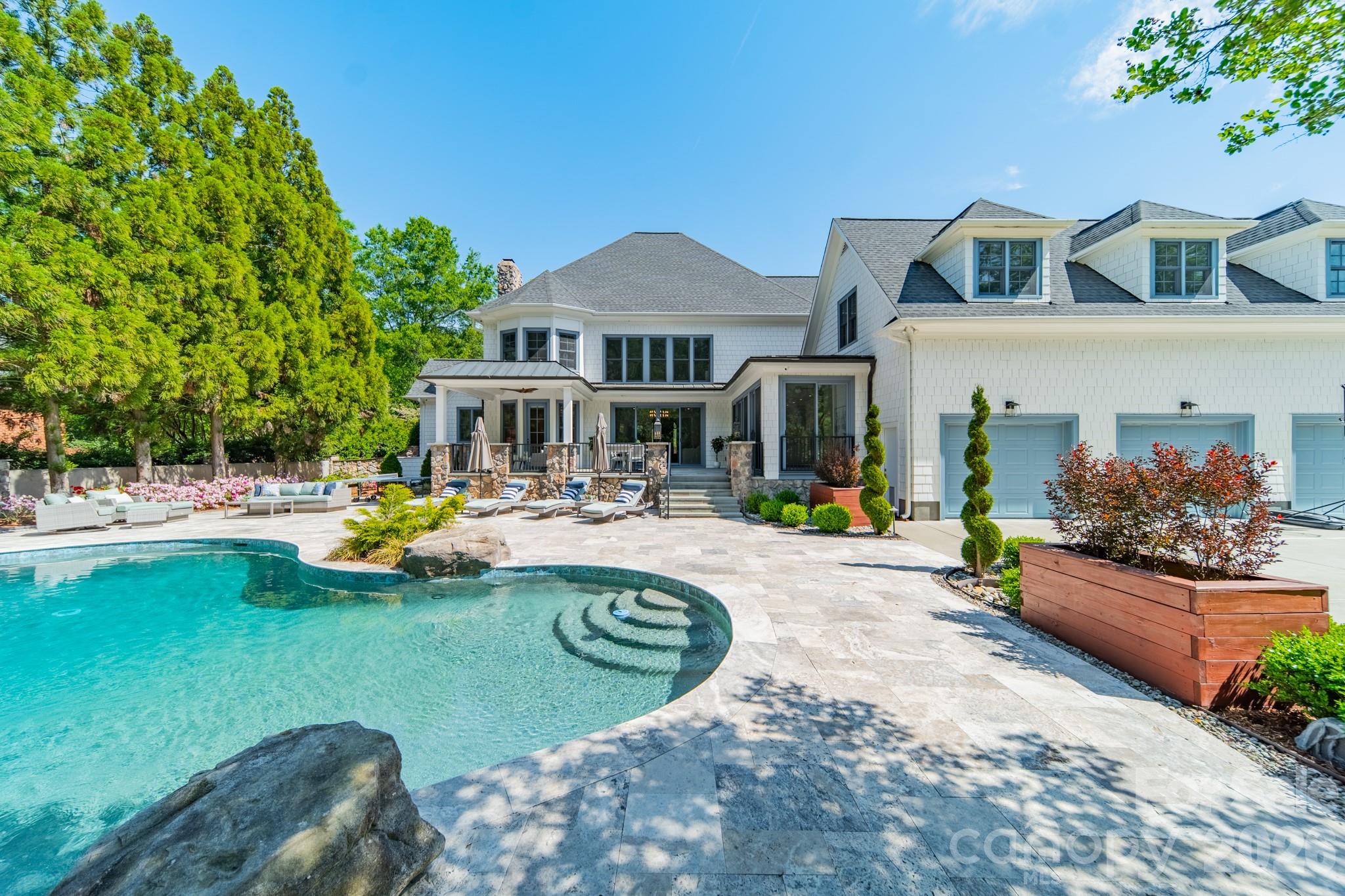 5400 Colony Road Charlotte, NC 28226 - Photo 36 of 48 a view of a house with swimming pool and sitting area