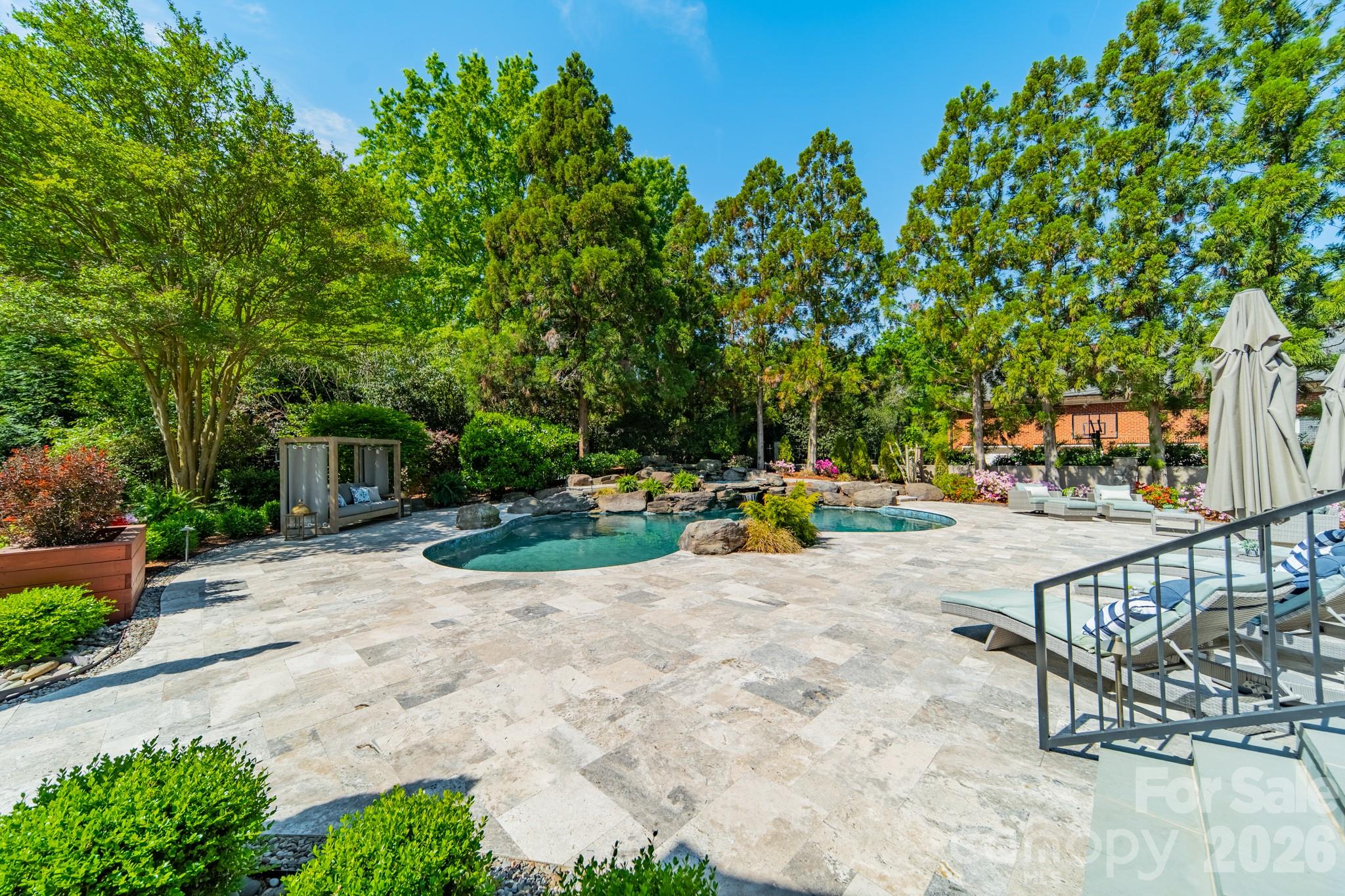 5400 Colony Road Charlotte, NC 28226 - Photo 41 of 48 a view of a swimming pool with a patio