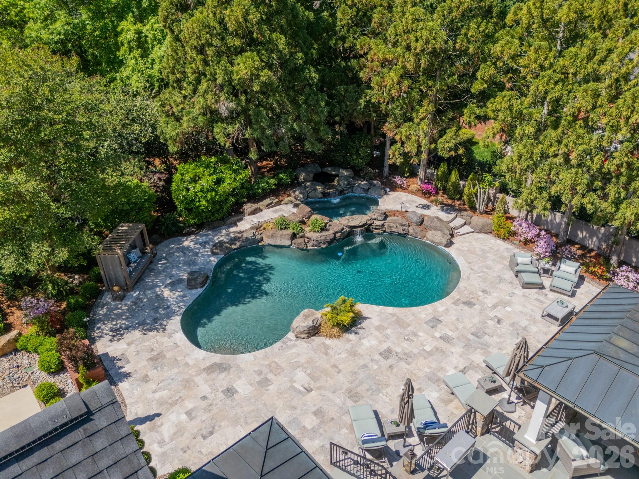 5400 Colony Road Charlotte, NC 28226 - Photo 48 of 48 a view of a swimming pool with lawn chairs and plants