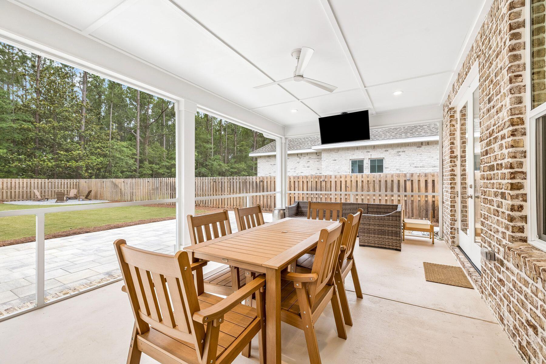39 West Captain Fritz Way Freeport, FL 32439 - Photo 11 of 33 a view of a patio with a tv
