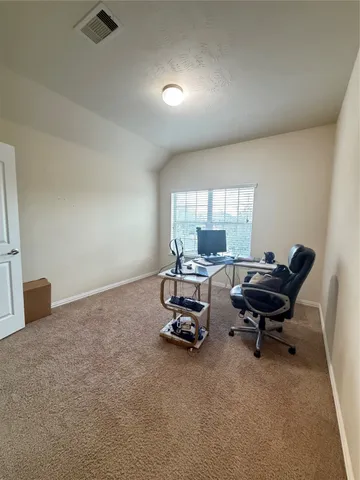 a living room with furniture a air conditioner and a window